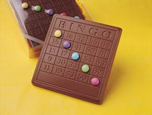 Picture shows a bingo card made out of chocolate with smarties being used to cover up numbers. 
